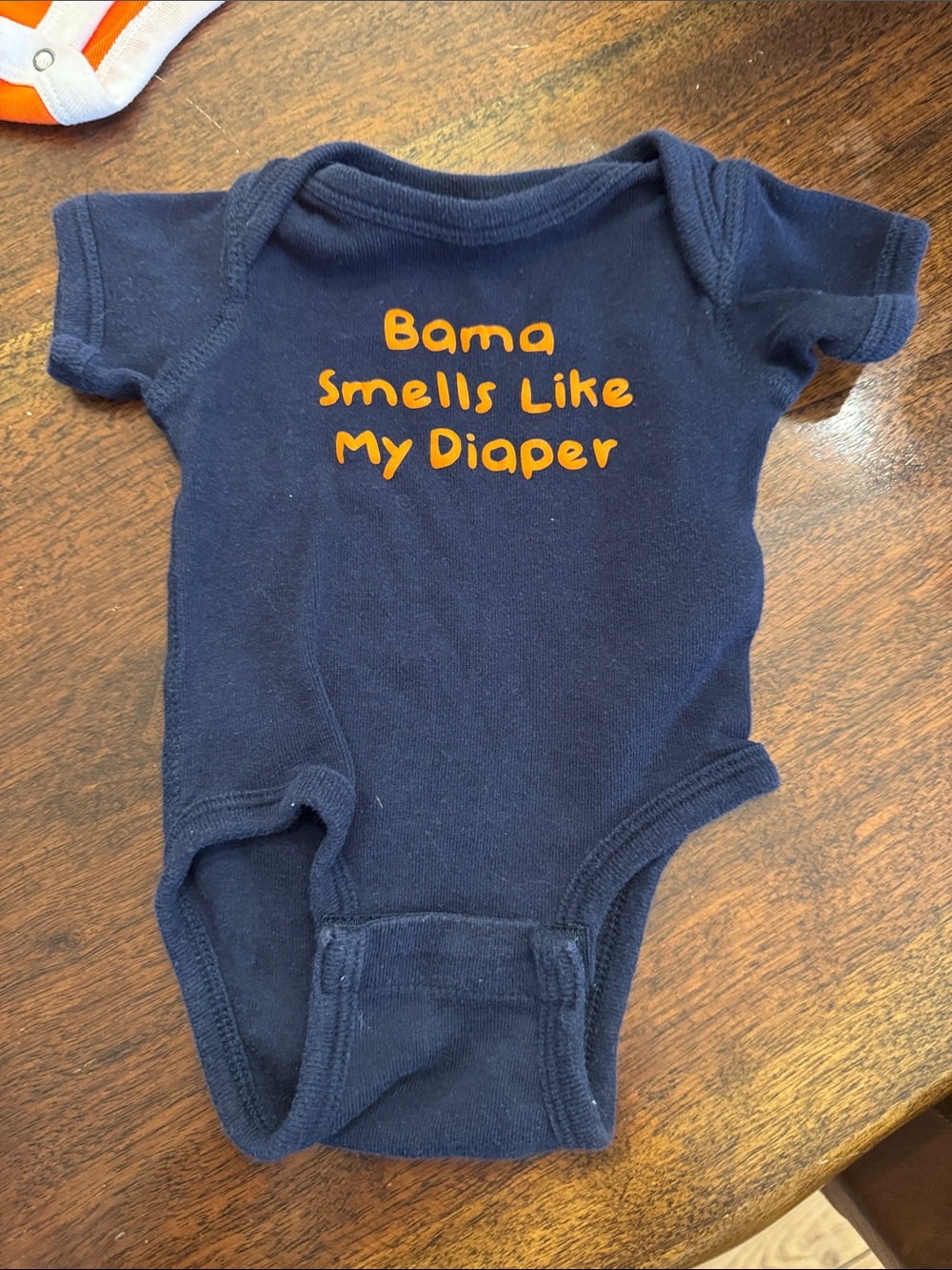 Navy Baby One-Piece with Orange Text - 'Bama Smells Like My Diaper'